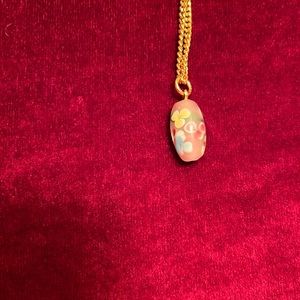 2/15 Vintage pink millefiore bead on a gold tone necklace